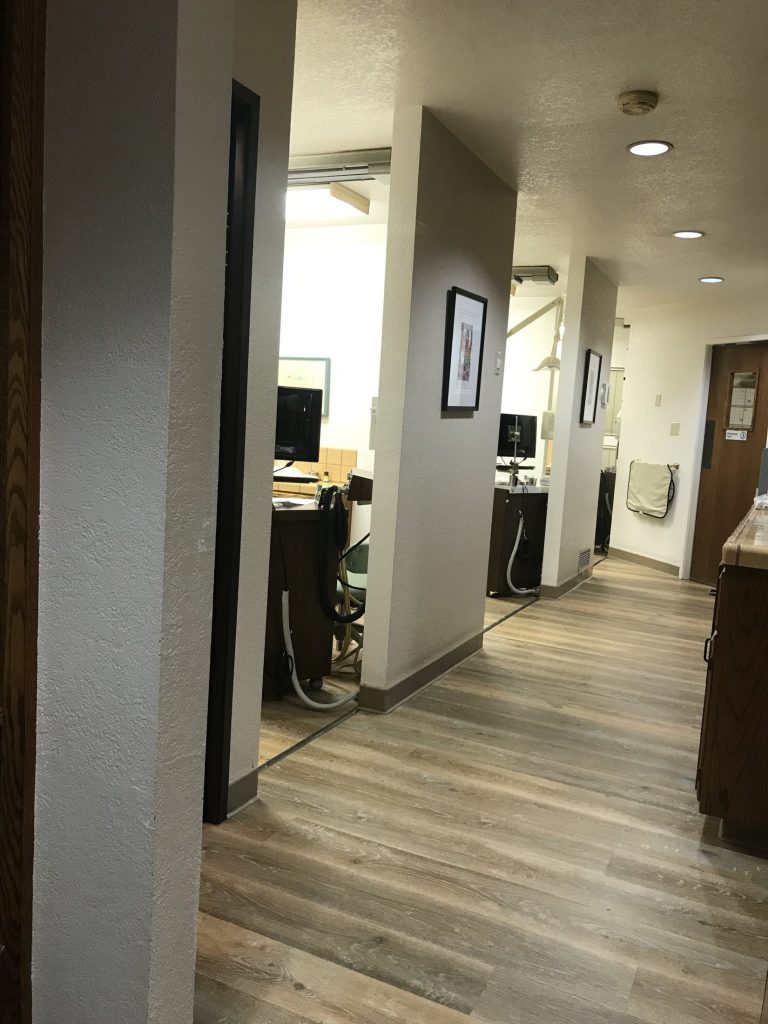 Hallway leading to patient rooms of {PRACTICE_NAME}